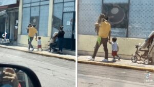 Il papà porta il cane in braccio per non farlo camminare sull’asfalto caldo (VIDEO)